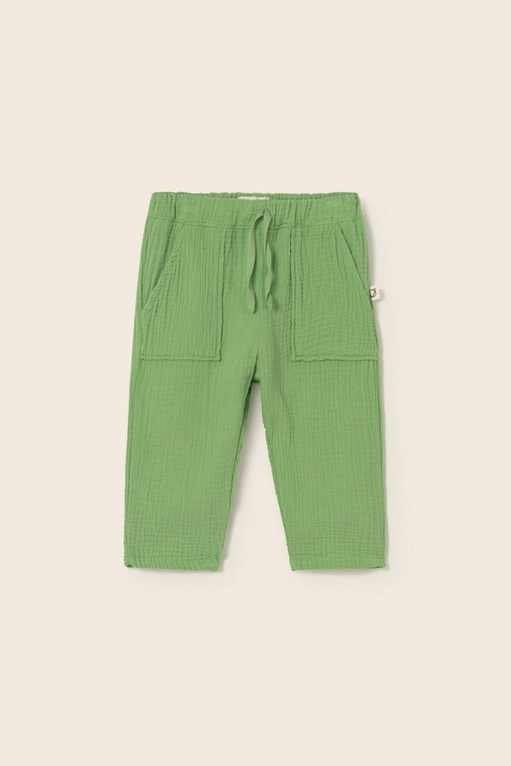 Soft cotton muslin baby pants in green with elastic waist