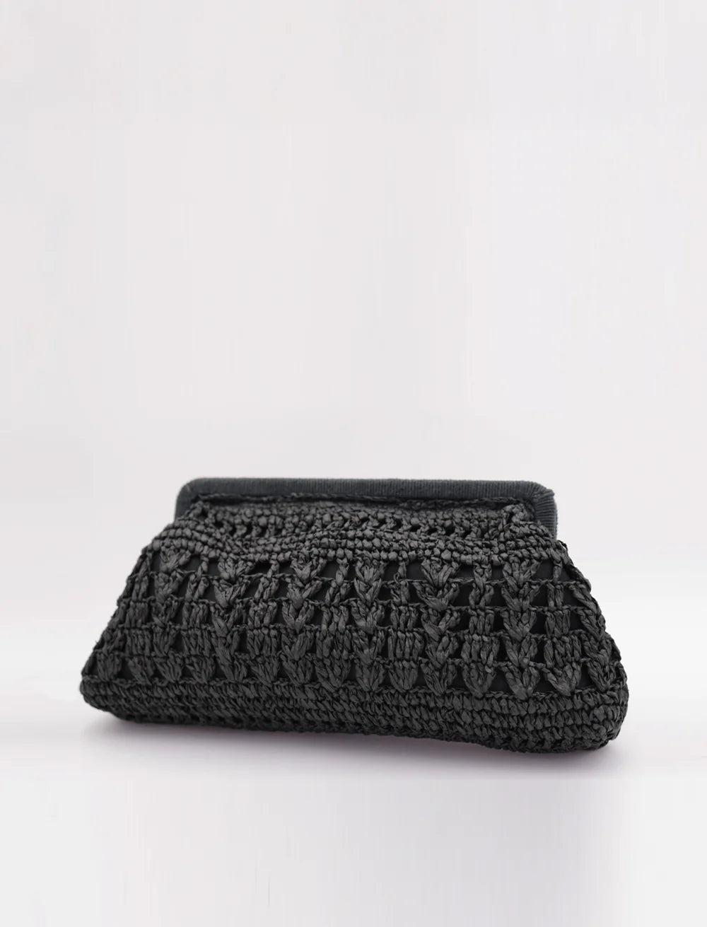 Black textured clutch bag on a white background