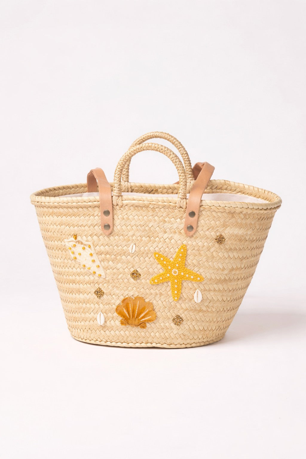 Handwoven straw beach basket with shell and starfish embroidery and leather handles