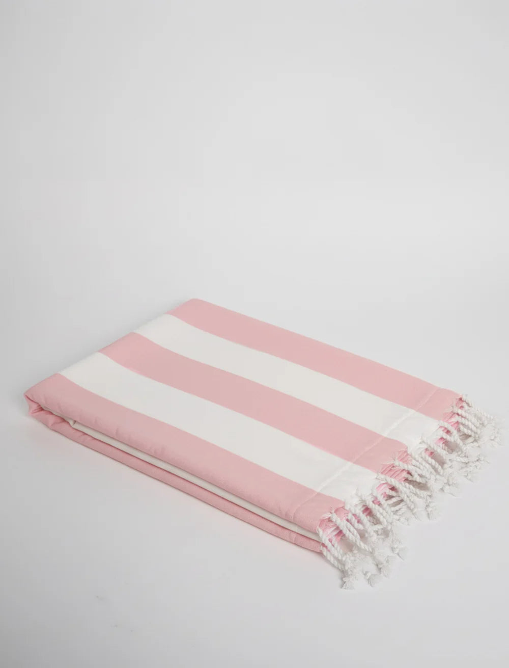 Soft striped cotton beach towel with tassels in pastel tones