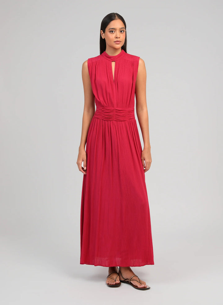 An’ge Orlany maxi dress with gathered waist and flowing sleeveless silhouette