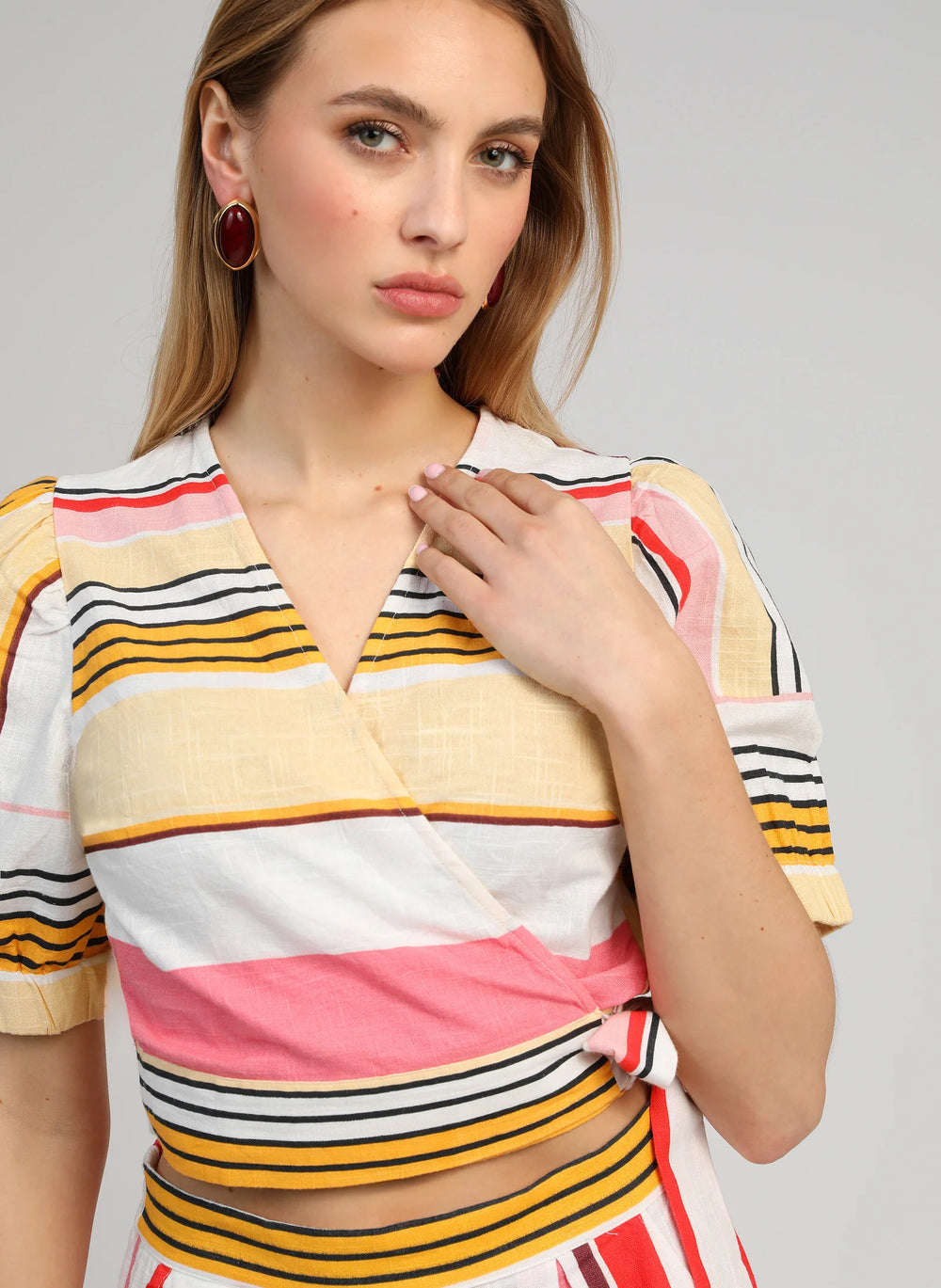 An’ge Soriana Belinda multicolor striped wrap top with short puff sleeves and side tie detail