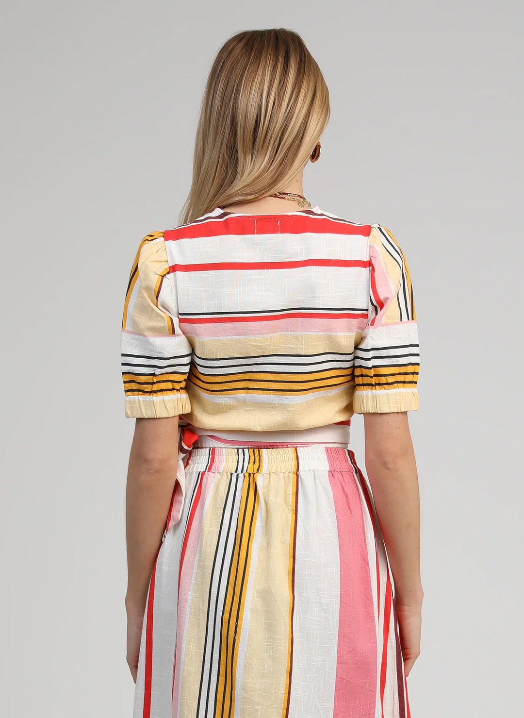 An’ge Soriana Belinda multicolor striped wrap top with short puff sleeves and side tie detail