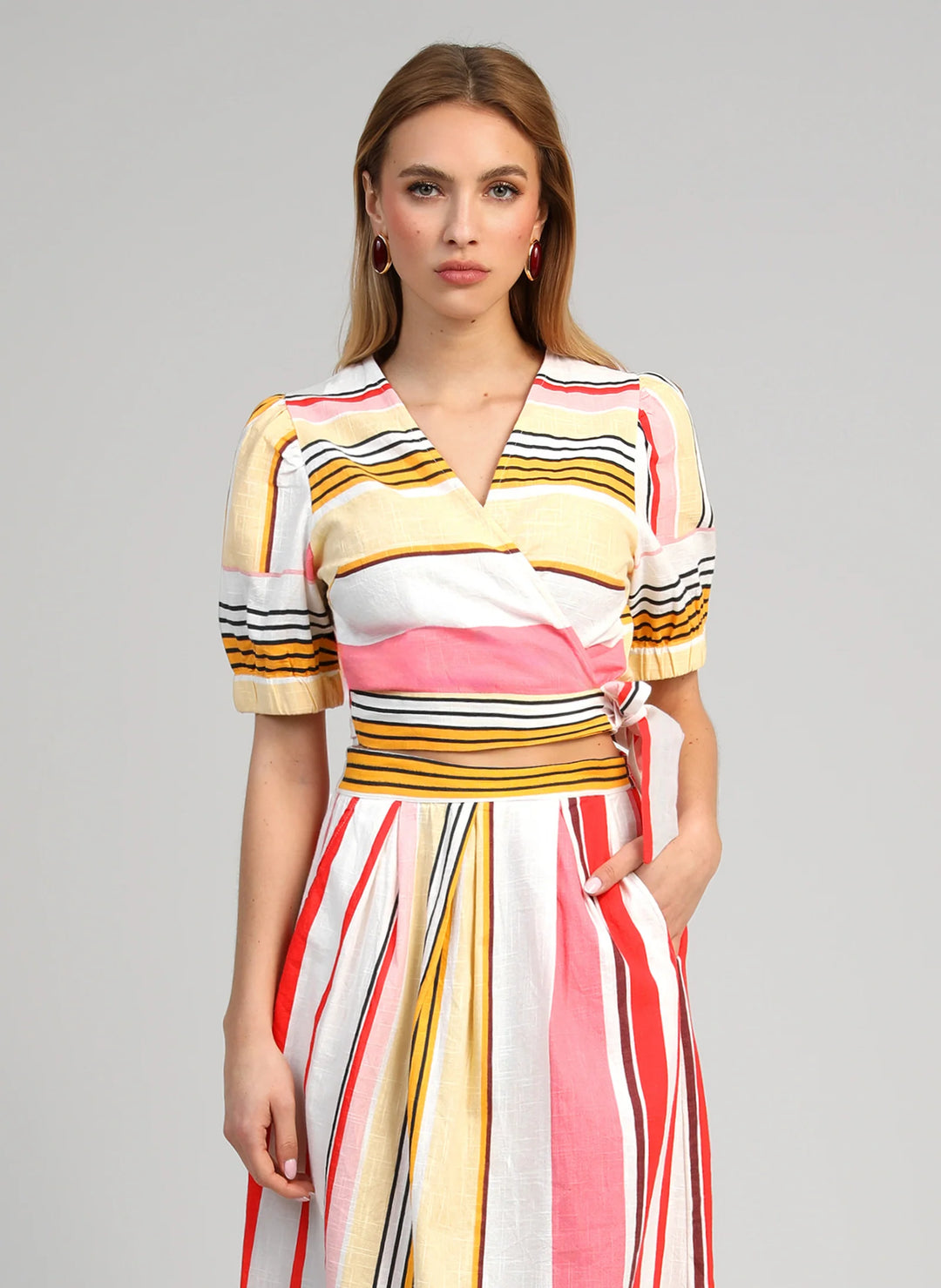 An’ge Soriana Belinda multicolor striped wrap top with short puff sleeves and side tie detail