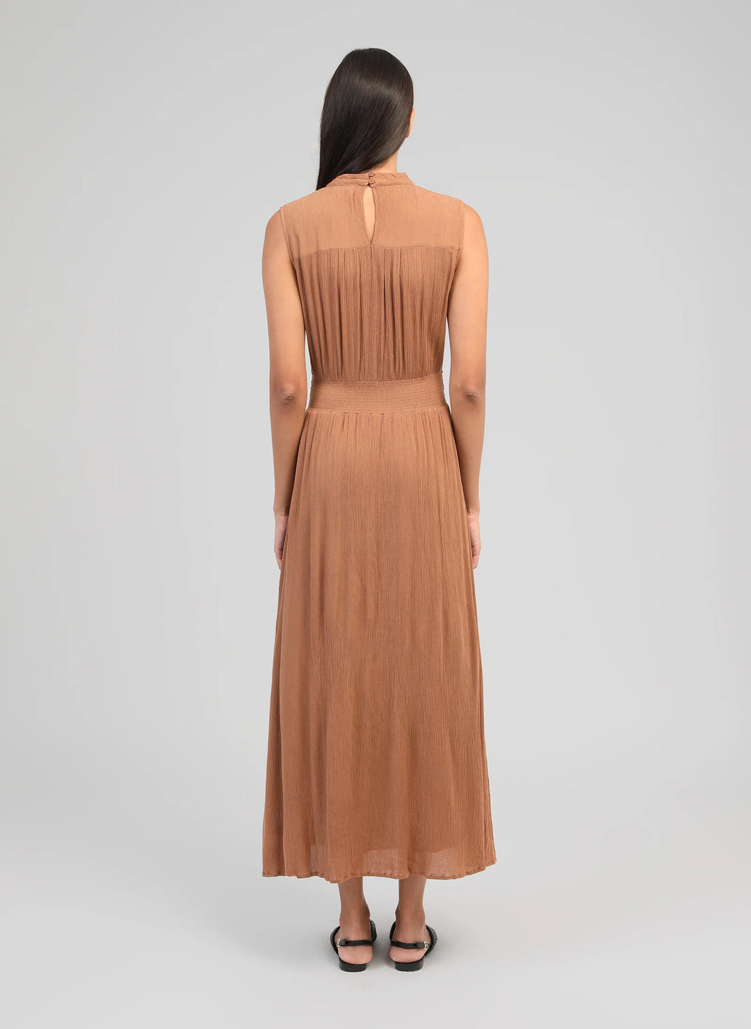 An’ge Orlany maxi dress with gathered waist and flowing sleeveless silhouette
