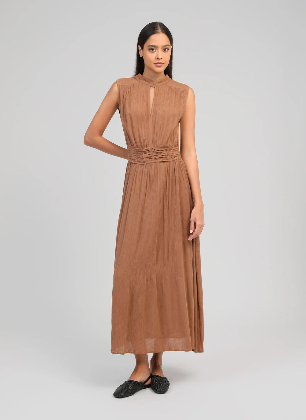 An’ge Orlany maxi dress with gathered waist and flowing sleeveless silhouette