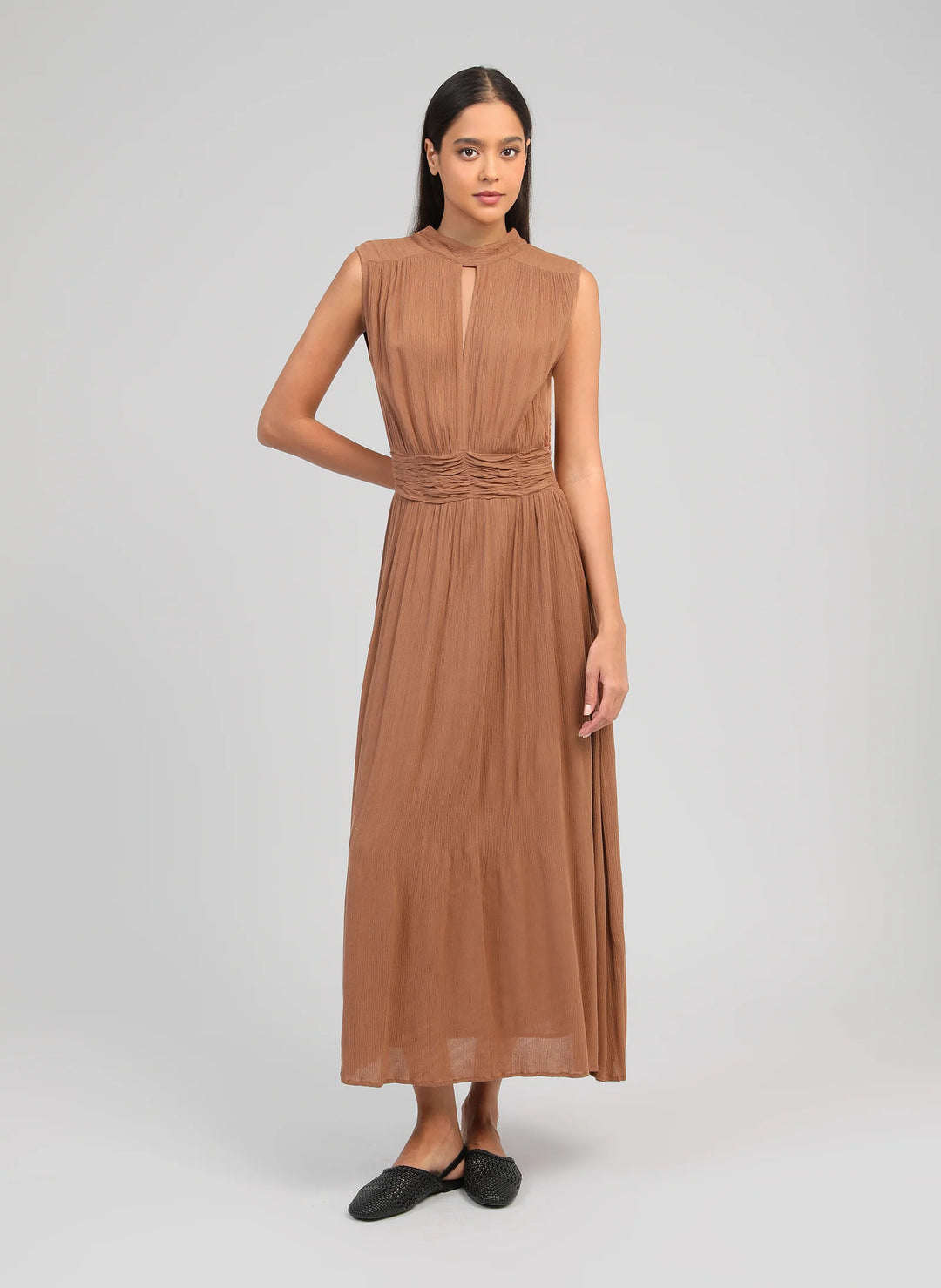 An’ge Orlany maxi dress with gathered waist and flowing sleeveless silhouette