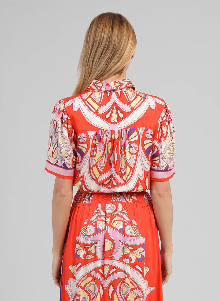 An’ge Suzalia Astola printed shirt in piment tones with retro pattern and front tie detail