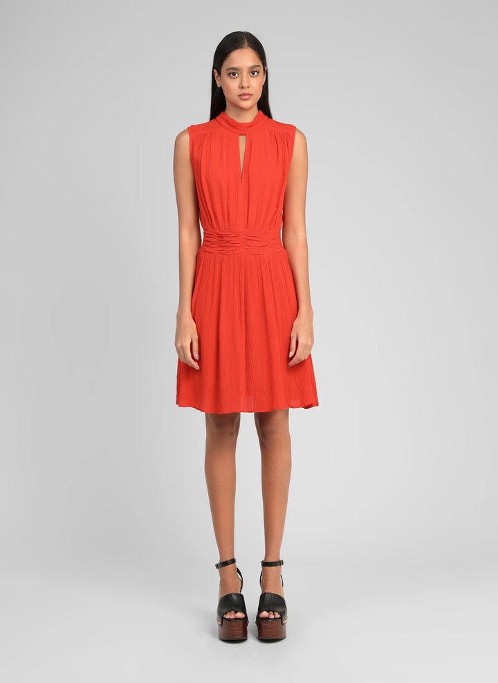 An’ge Orleane piment short dress with gathered waist and sleeveless flared silhouette
