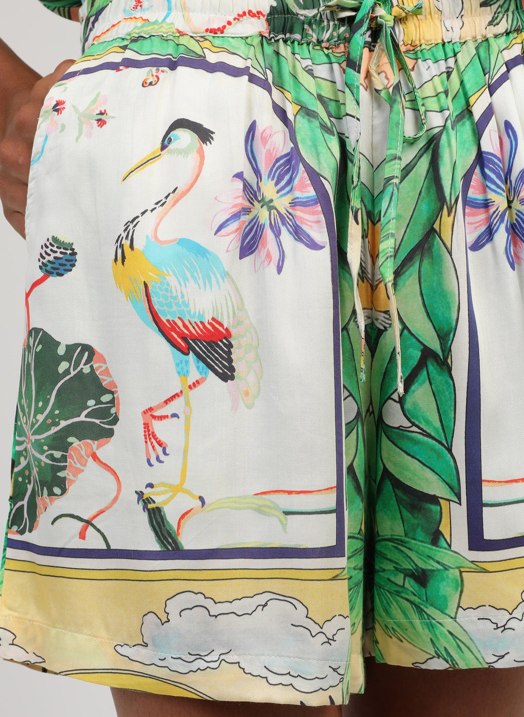 An’ge Rilvana Naturalia sky blue printed shorts with tropical botanical and bird motifs