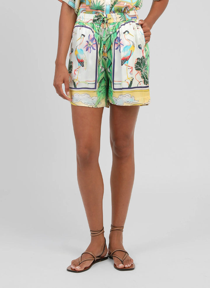 An’ge Rilvana Naturalia sky blue printed shorts with tropical botanical and bird motifs