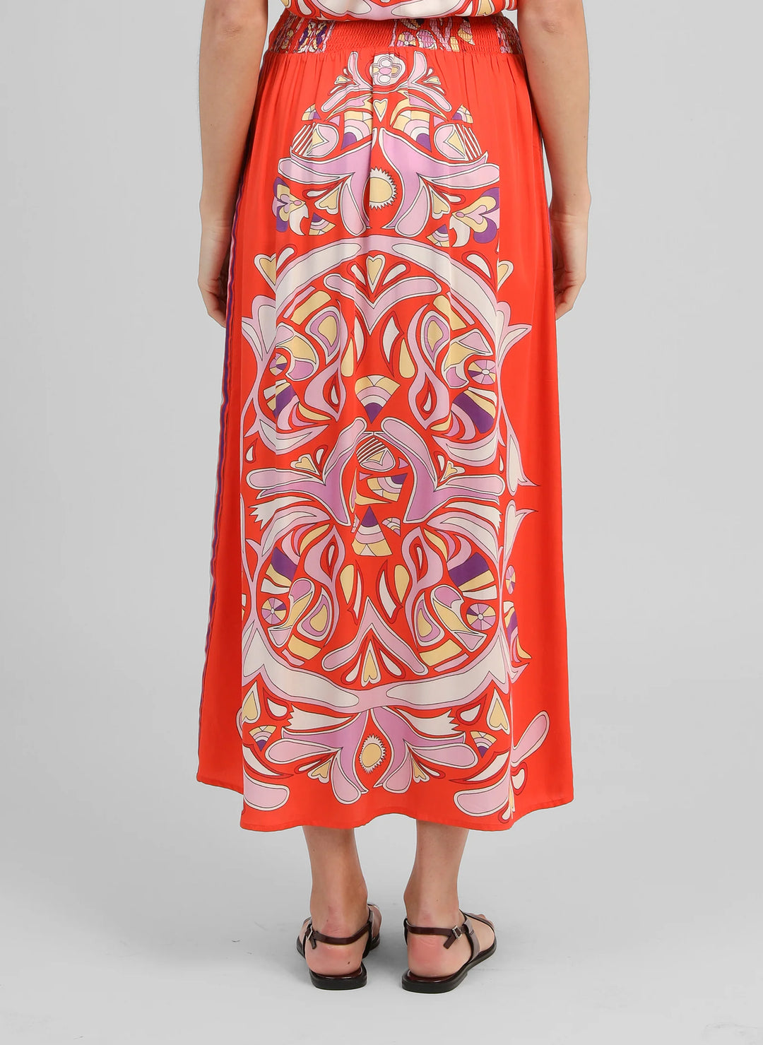 An’ge Robinson red printed midi skirt with vibrant retro-inspired pattern