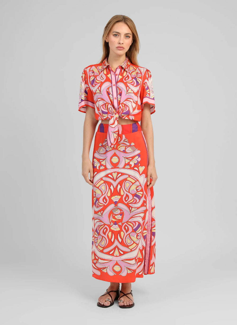 An’ge Robinson red printed midi skirt with vibrant retro-inspired pattern