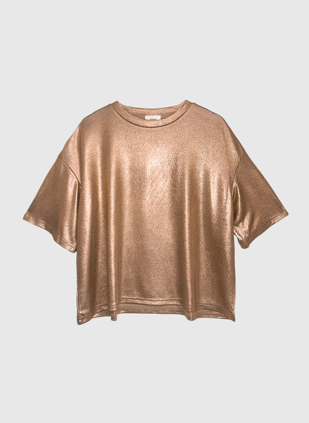 Woman wearing the An’ge Akomila gold metallic oversized t-shirt with a relaxed fit and short sleeves.