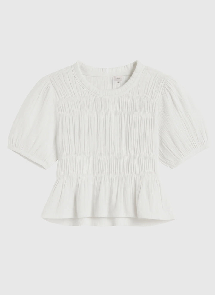 An’ge Sizaya smocked top with puff sleeves and peplum hem in lightweight textured fabric