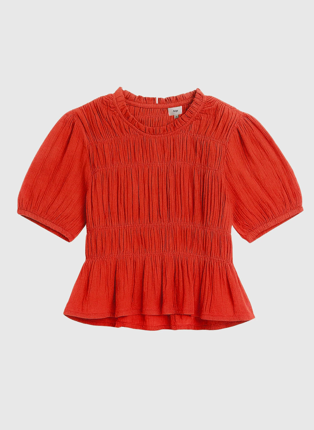An’ge Sizaya smocked top with puff sleeves and peplum hem in lightweight textured fabric