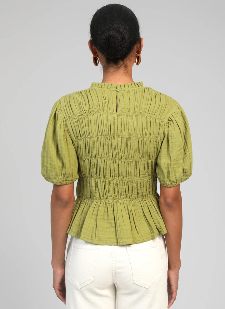 An’ge Sizaya smocked top with puff sleeves and peplum hem in lightweight textured fabric