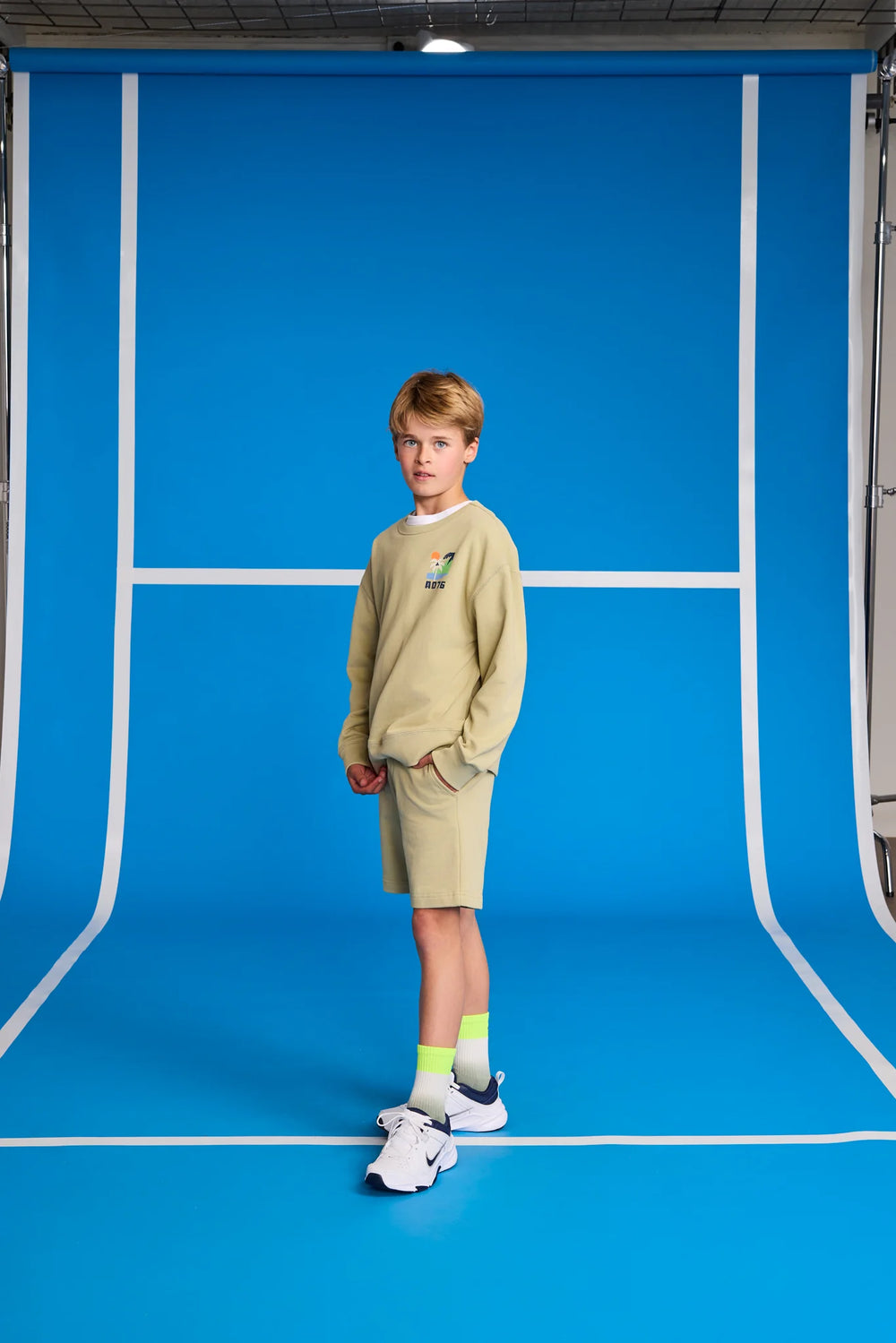 boys khaki green shorts with button closure
