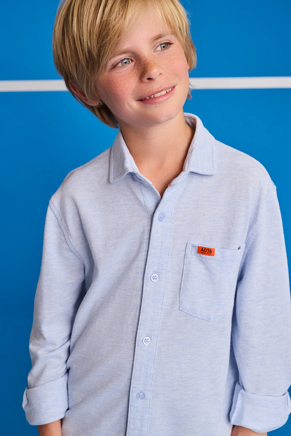 boys light blue long sleeve button down shirt with chest pocket
