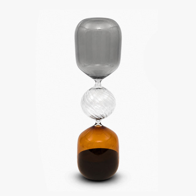 Large amber glass hourglass with elegant decorative design