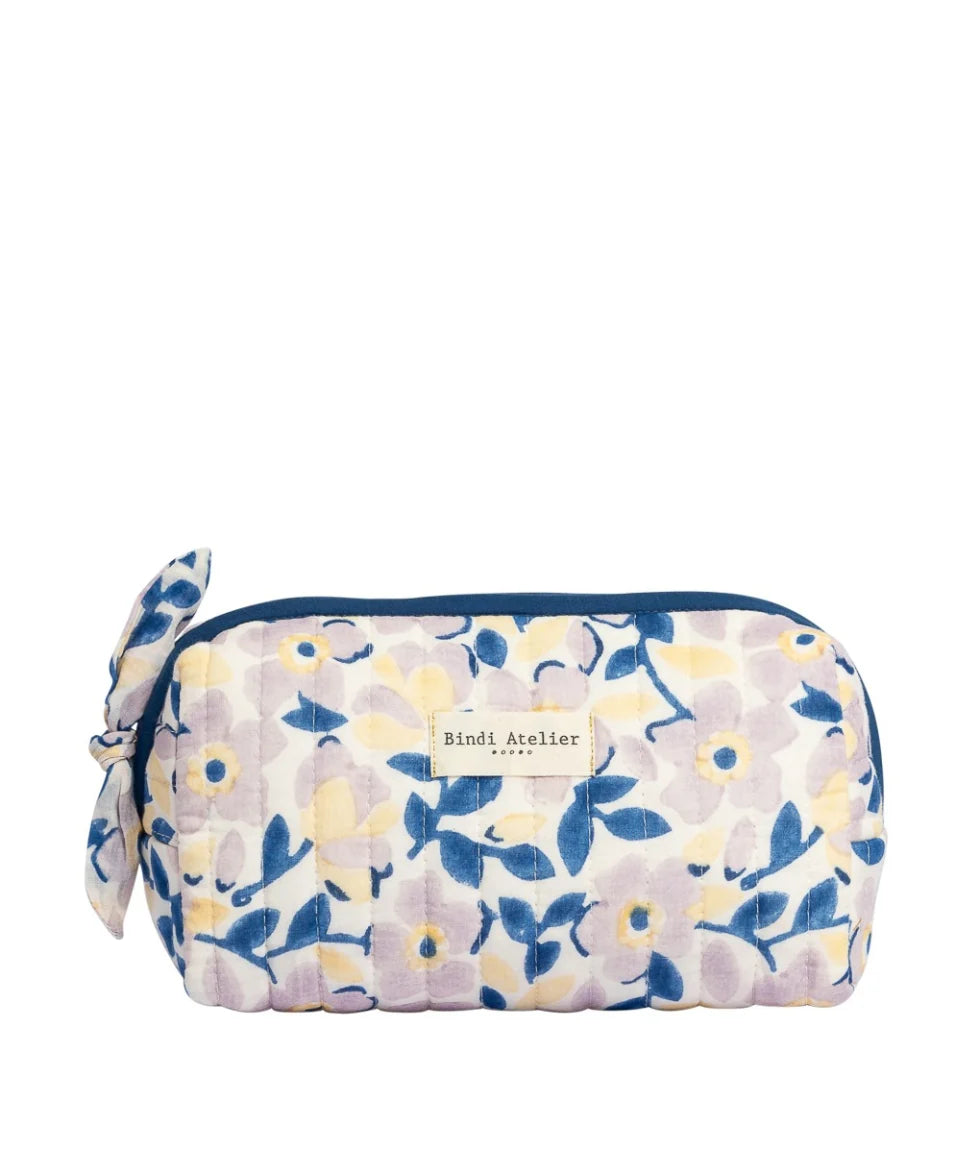 Blue floral quilted beauty pouch by Bindi Atelier with soft botanical print and zip closure