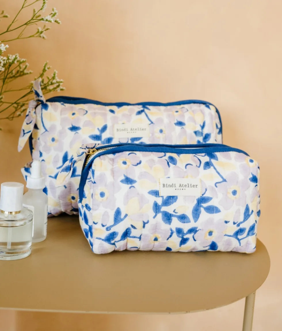 Blue floral quilted beauty pouch by Bindi Atelier with soft botanical print and zip closure