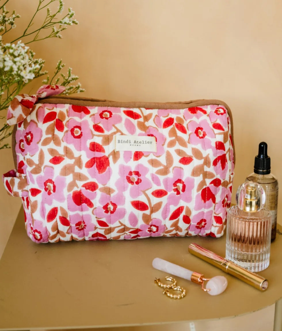 Pink floral quilted beauty pouch by Bindi Atelier with romantic botanical print and zip closure
