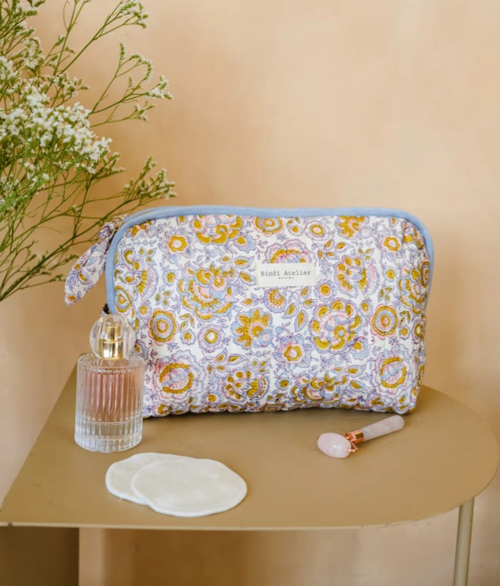 Blue floral quilted beauty pouch by Bindi Atelier with botanical block print and zip closure