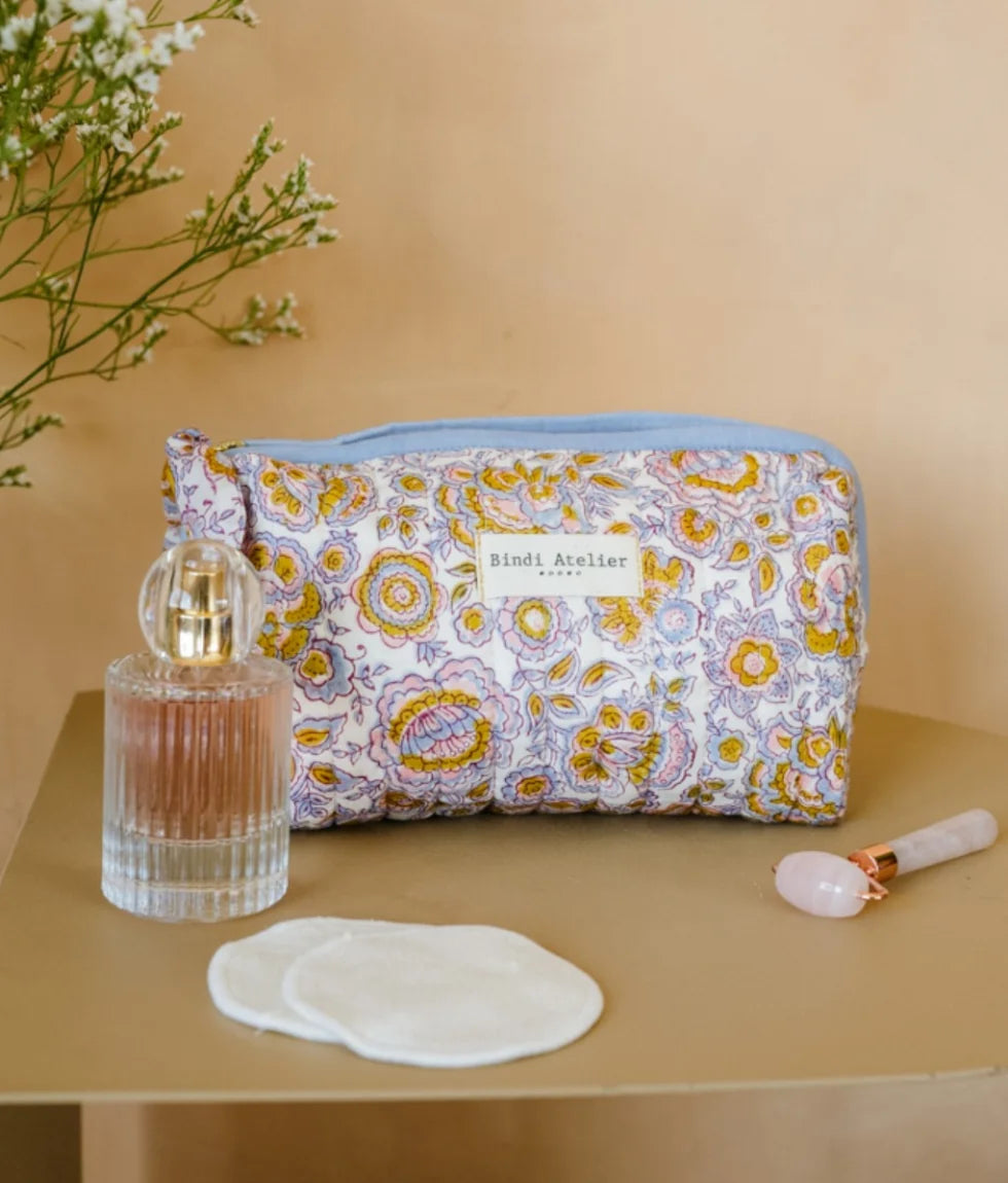 Blue floral quilted beauty pouch by Bindi Atelier with botanical block print and zip closure