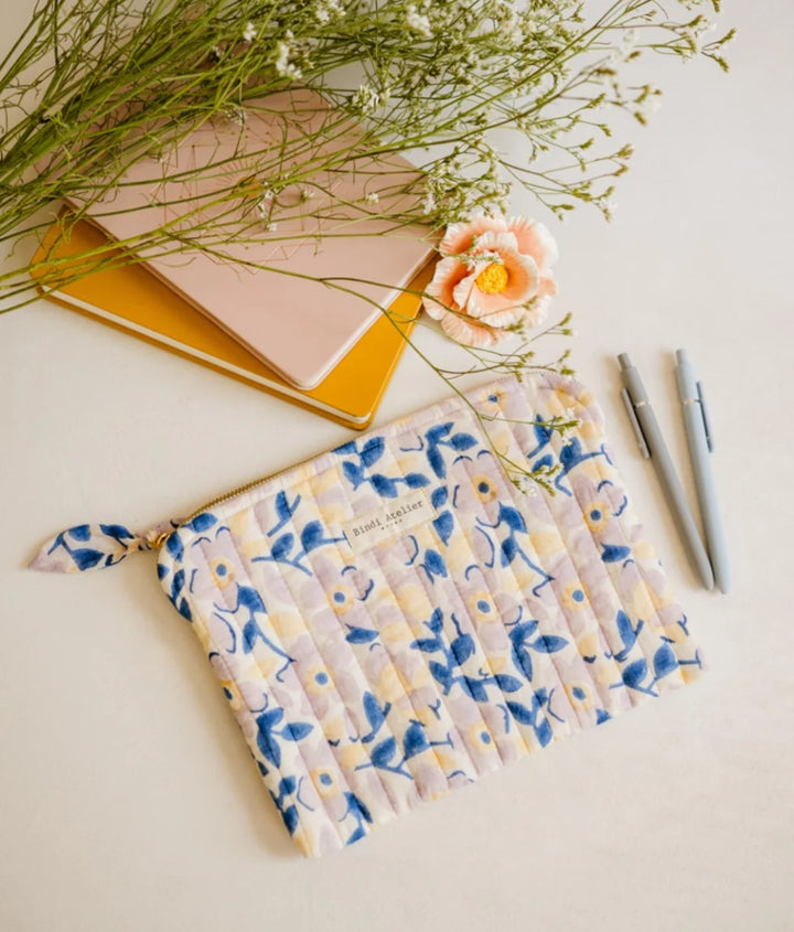 Blue floral quilted iPad pouch by Bindi Atelier with soft botanical print and zip closure