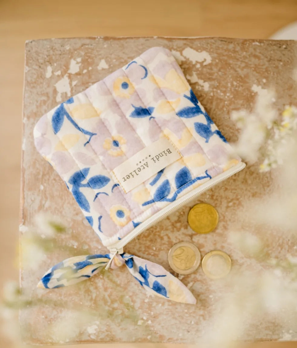 Small quilted blue floral coin purse by Bindi Atelier with soft botanical print and zip closure