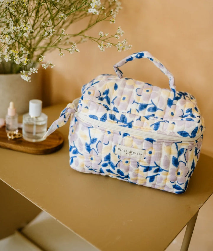Blue floral quilted vanity case by Bindi Atelier with top handle and spacious zip storage