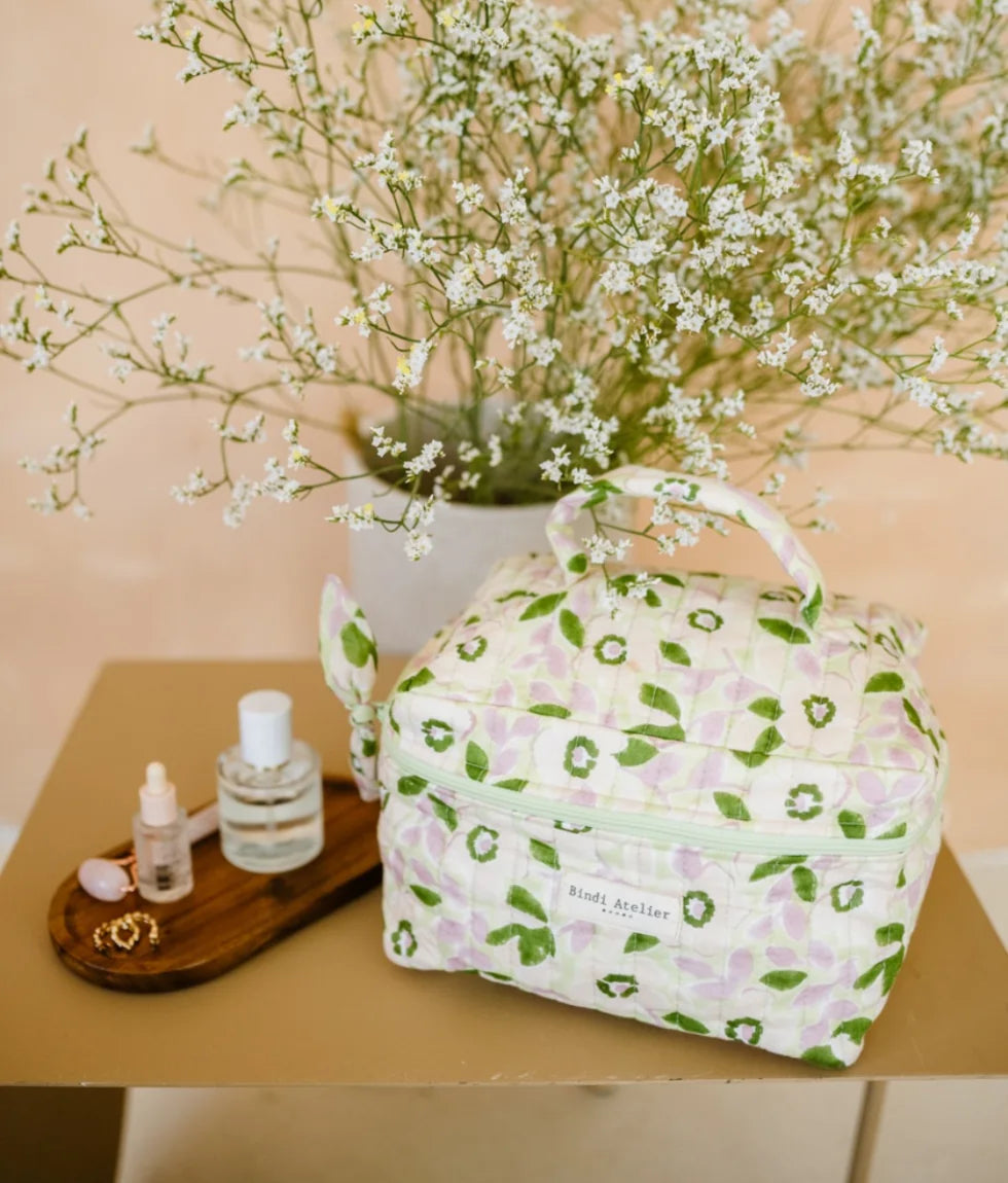 Green floral quilted vanity case by Bindi Atelier with top handle and zip closure