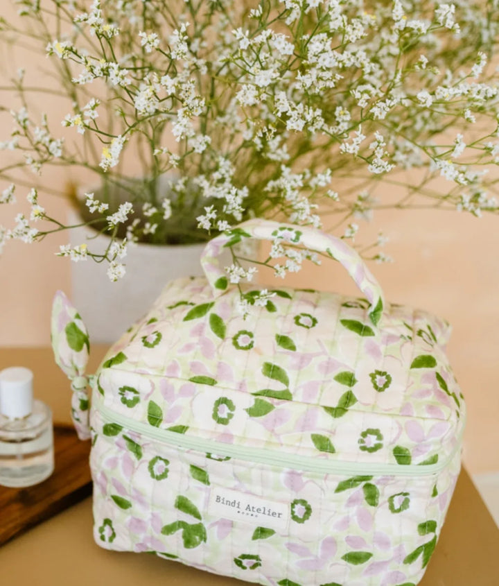 Green floral quilted vanity case by Bindi Atelier with top handle and zip closure