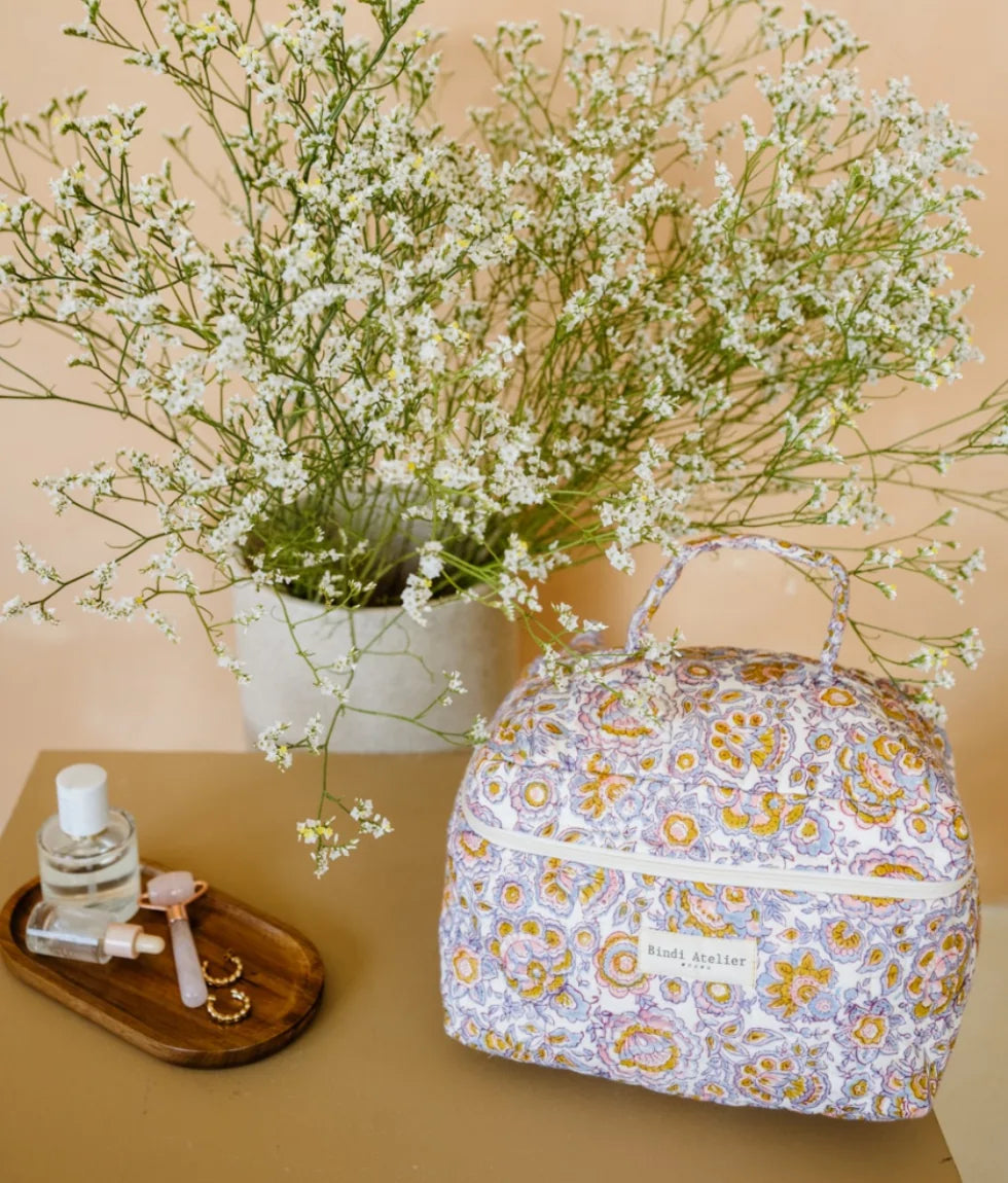 Quilted floral vanity case by Bindi Atelier with elegant pastel print and top carry handle