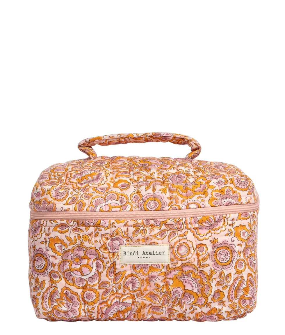 Floral quilted vanity case in pink and amber tones by Bindi Atelier with zip closure and carry handle