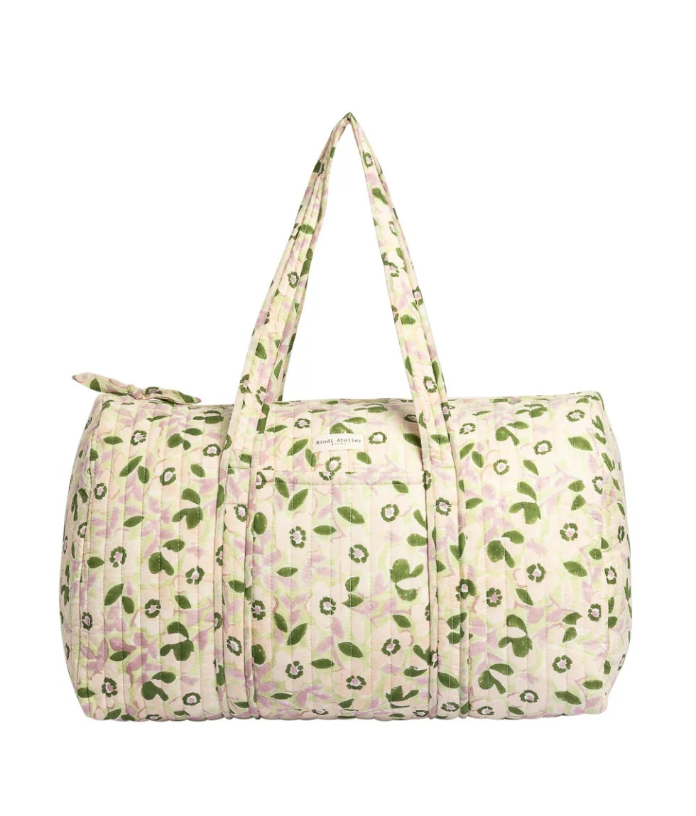 Green floral quilted cotton weekender bag with padded handles and spacious overnight travel design