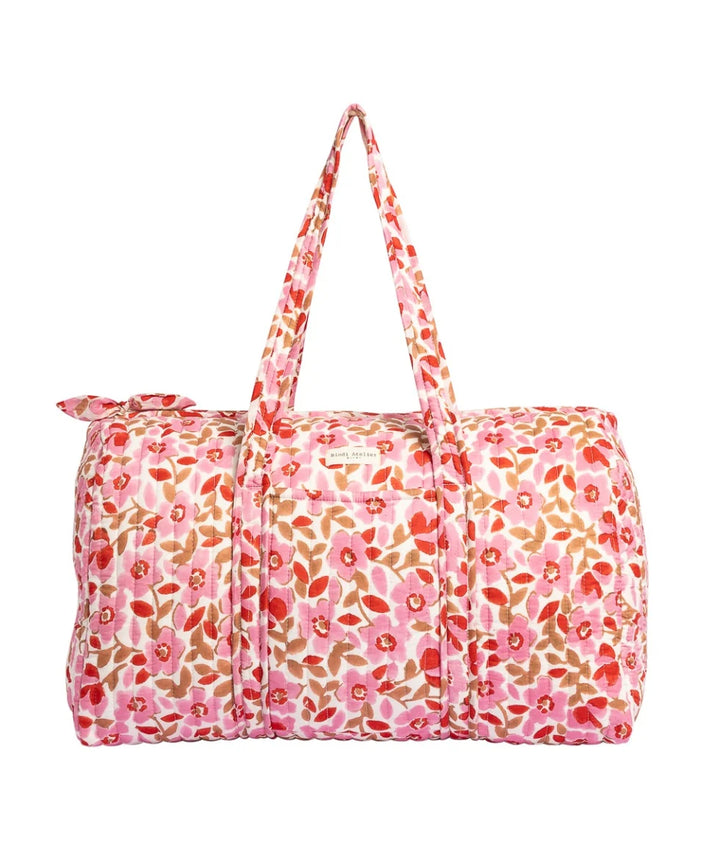 Pink floral quilted cotton weekender bag with padded handles and spacious travel design