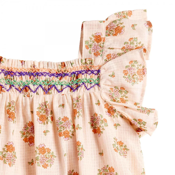 Bonheur du Jour Antigua rose dress with floral print and handmade smocking
