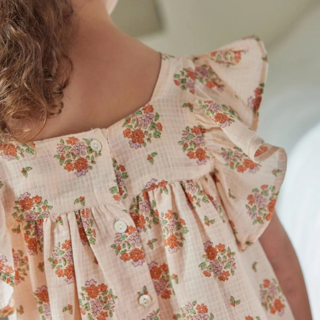 Bonheur du Jour Antigua rose dress with floral print and handmade smocking
