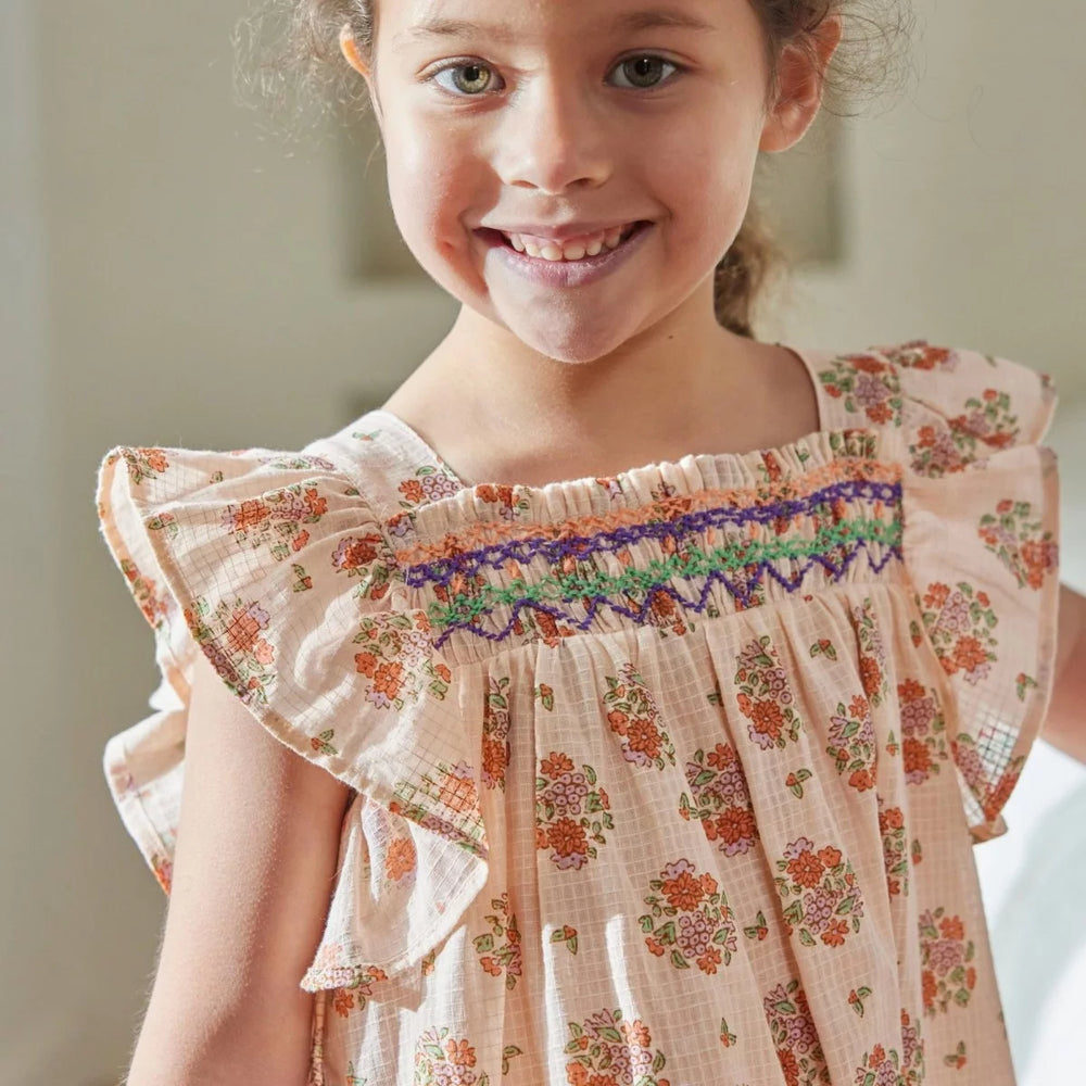 Bonheur du Jour Antigua rose dress with floral print and handmade smocking
