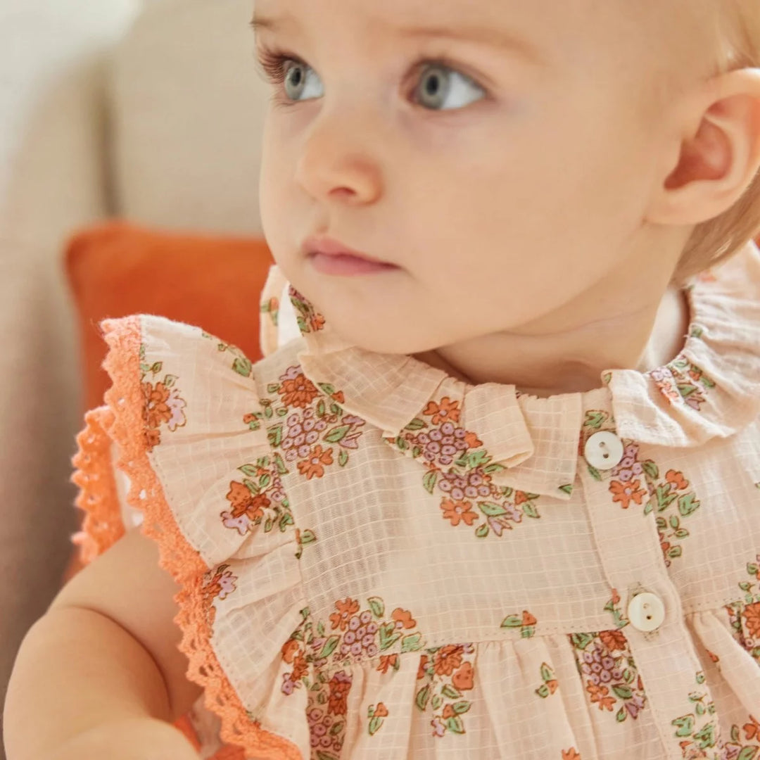 Bonheur du Jour Mahaut rose floral baby romper with lace ruffle sleeves
