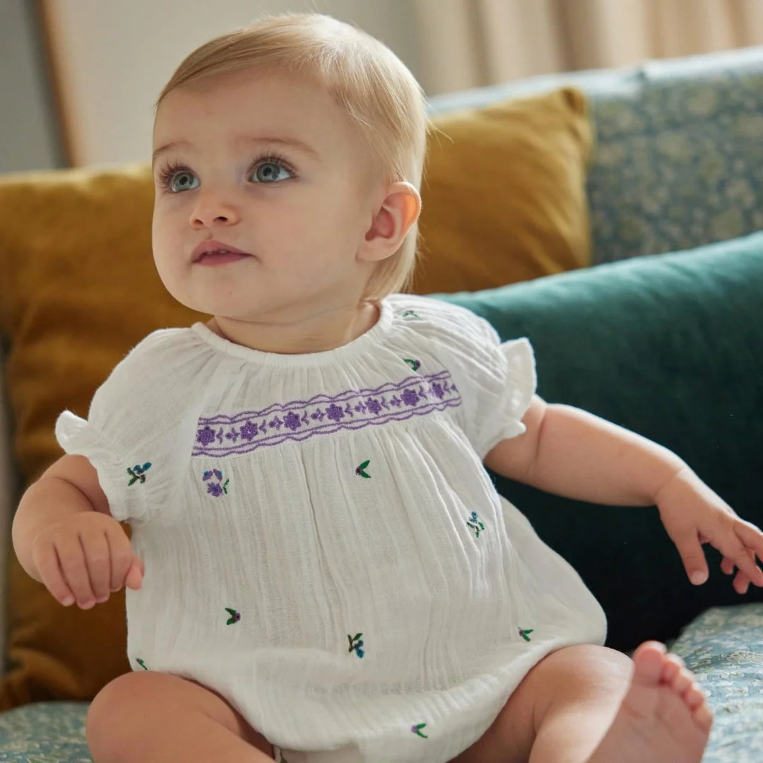 Bonheur du Jour Gaby ecru baby romper with floral embroidery and smocked yoke
