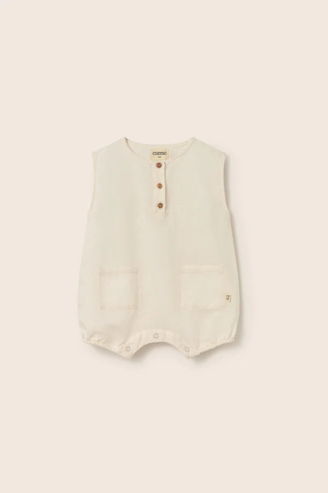 Baby cotton linen romper in soft cream with button front and front pockets