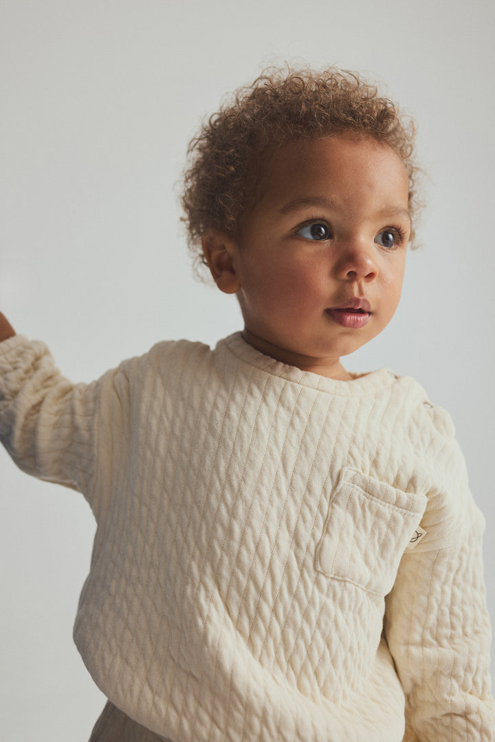 Cozmo ivory quilted cotton baby sweatshirt with chest pocket