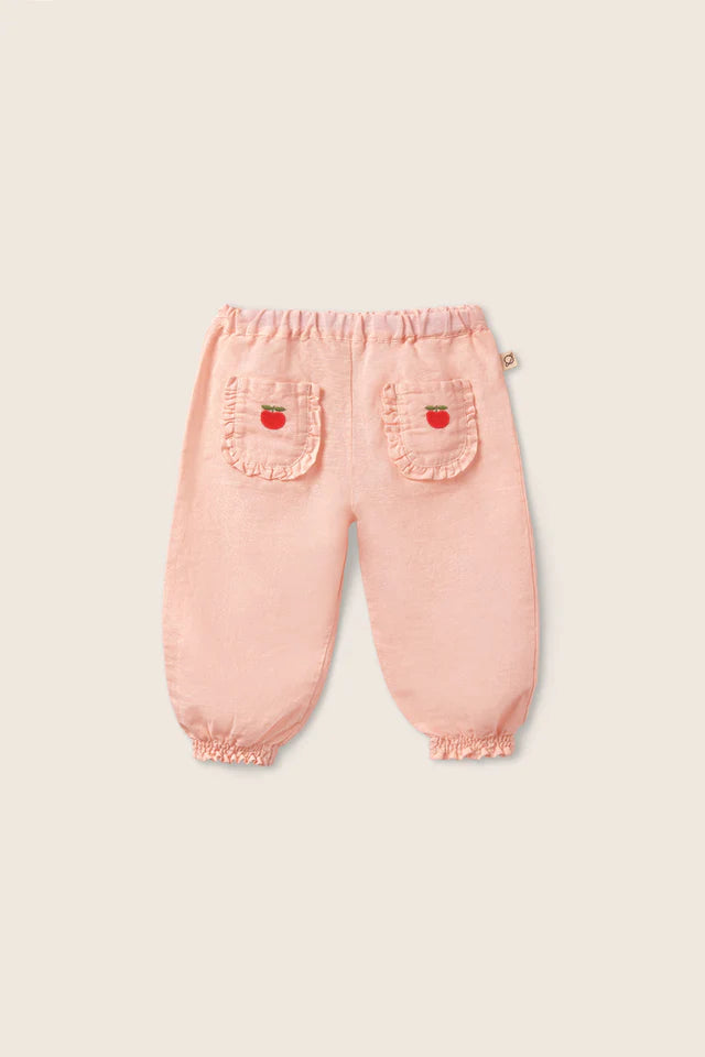 Baby girls cotton linen pants in soft pink with elastic waist and embroidered pocket details