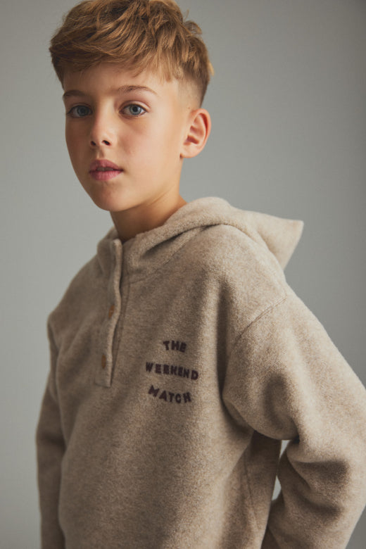 Cozmo boys soft bamboo hoodie in stone with button neckline, relaxed fit and The Weekend Match chest print