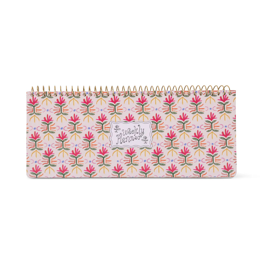 Colorful weekly planner pad with patterned design and spiral binding for desk organization
