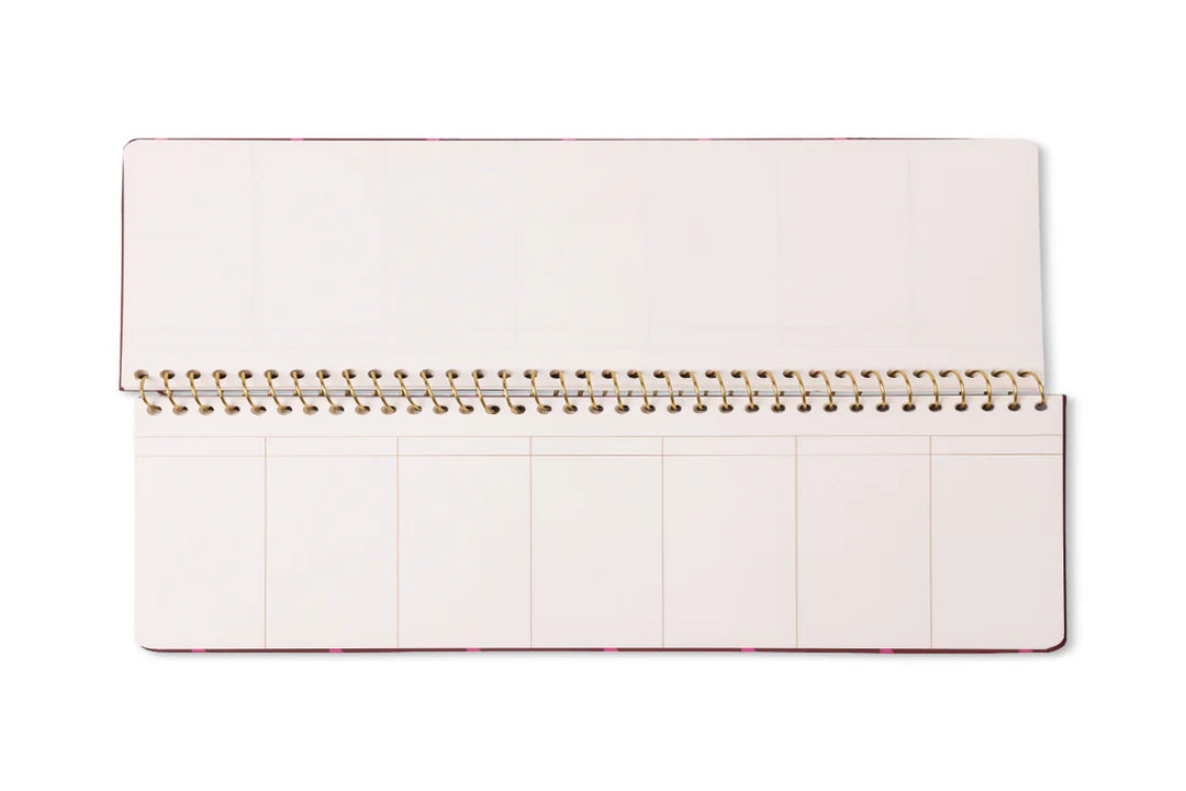 Colorful weekly planner pad with patterned design and spiral binding for desk organization

