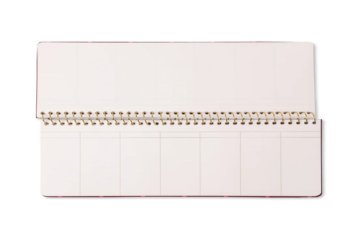 Colorful weekly planner pad with patterned design and spiral binding for desk organization
